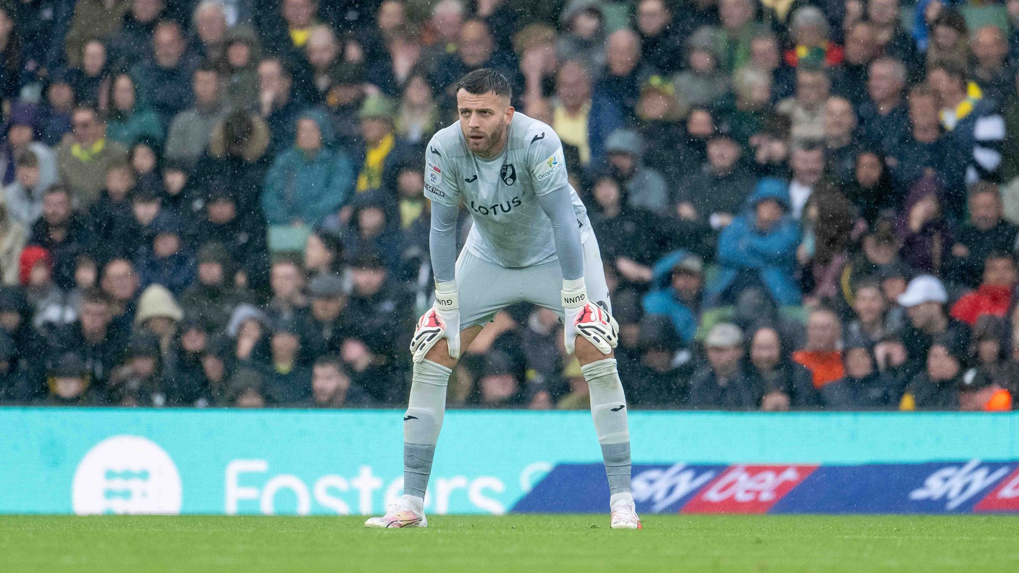 Angus Gunn crouched in goal